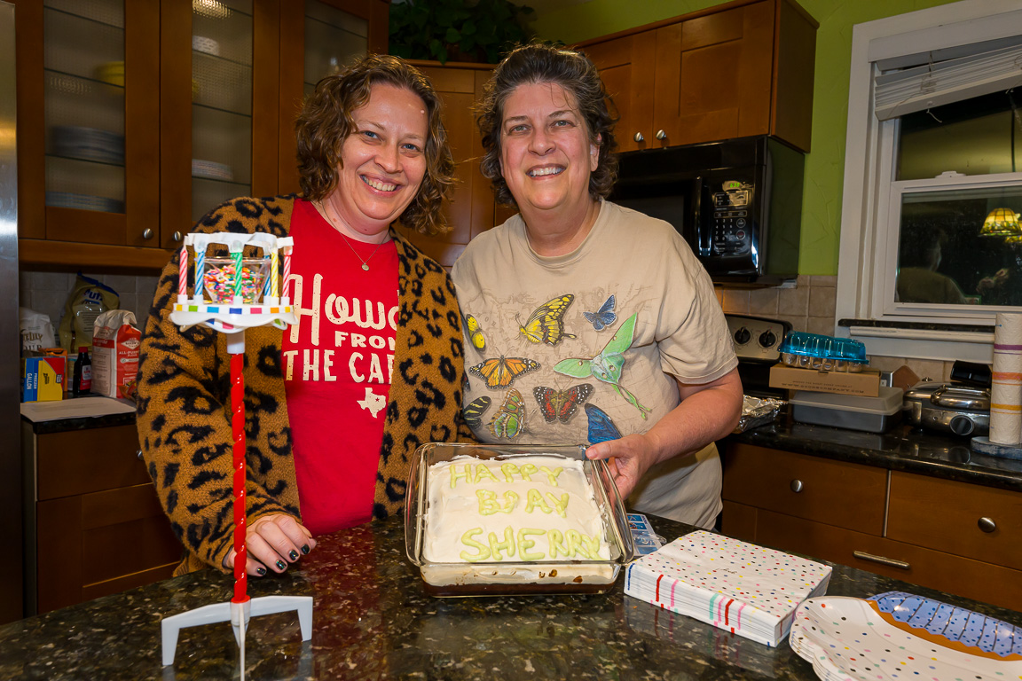 Kristy and Sherry with a birthday cake